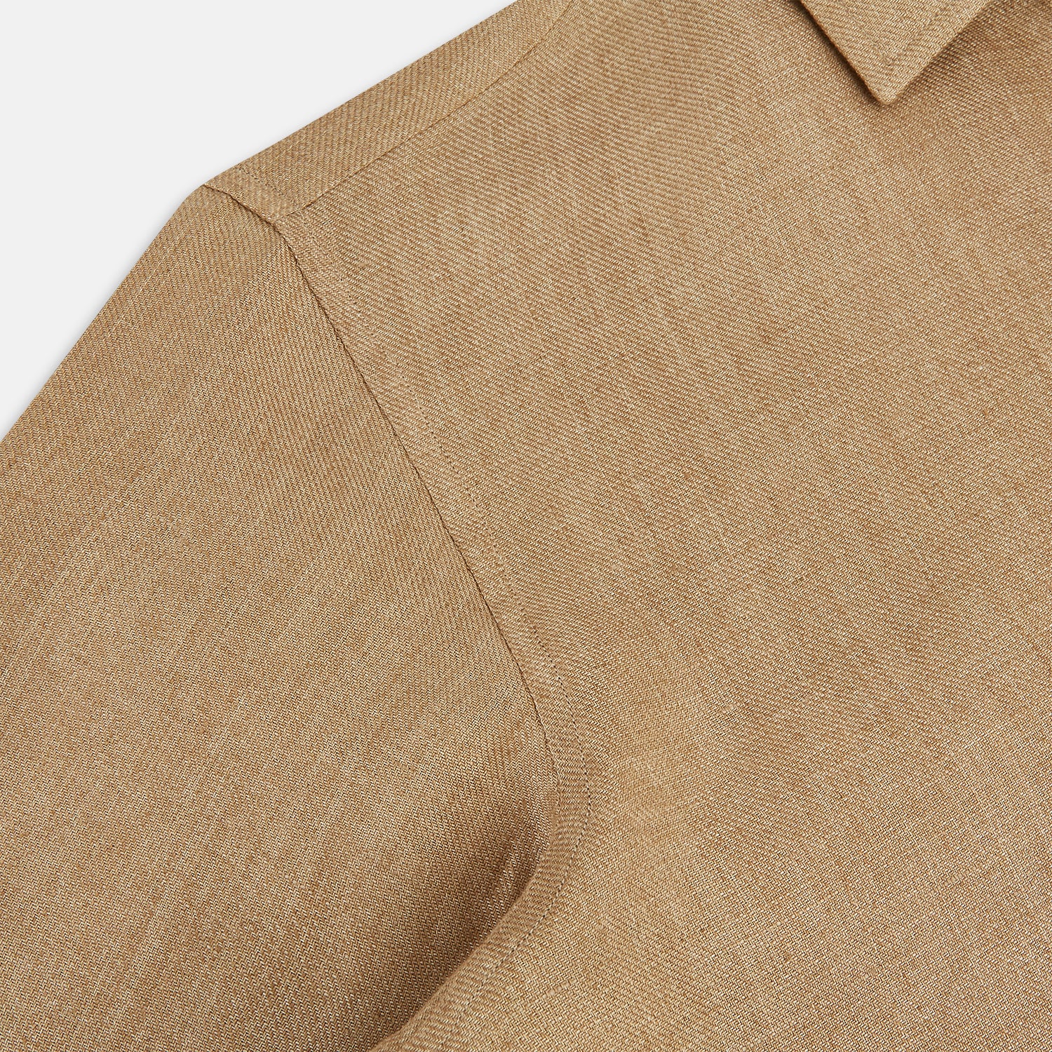 View 6 of product The Turnbull & Asser Camel Linen Windsor Shirt features long sleeves, a tailored fit, and classic collar in light brown camel linen, shown against a white background.
