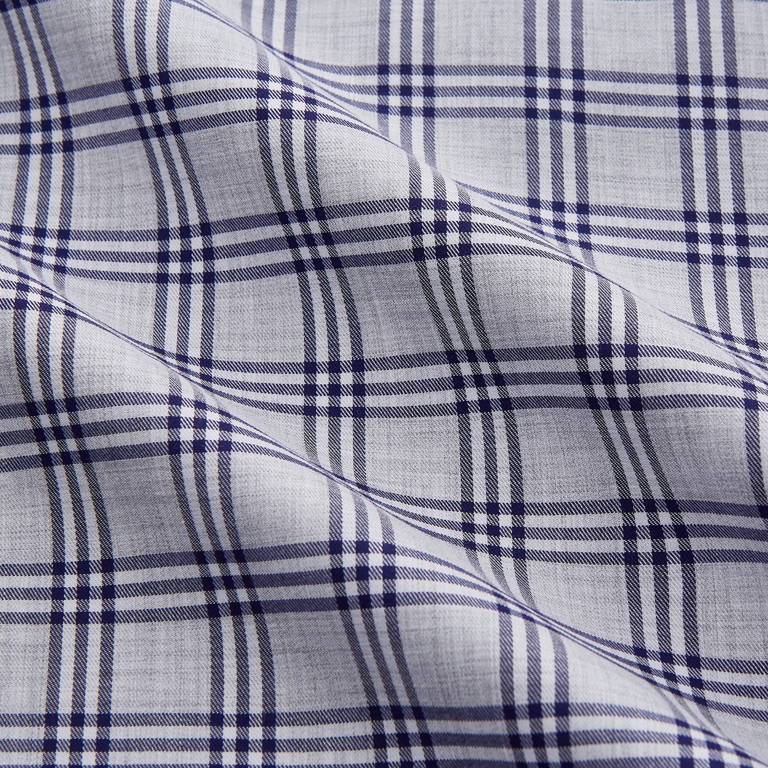 View 2 of product The Turnbull & Asser Grey Multi Check Cotton Tailored Fit Shelton Shirt is neatly laid flat on a white background.