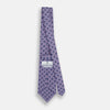 View 4 of product The Turnbull & Asser Lilac Medallion Silk Tie features a repeating navy medallion motif on textured lilac silk, adding refined style to any ensemble.