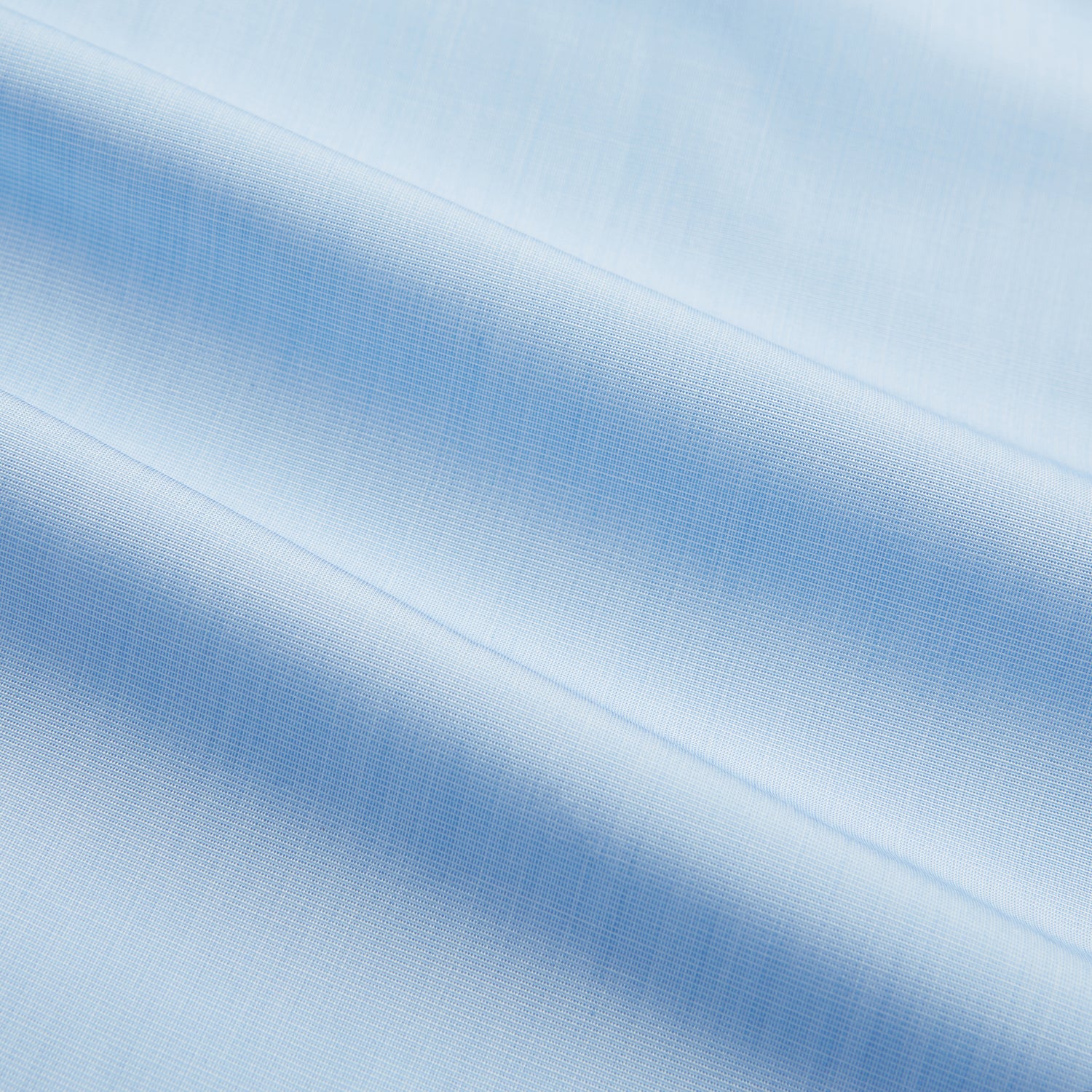 View 6 of product The Turnbull & Asser Light Blue End-on-End Shirt features a crisp white T&A contrast collar and double cuffs, shown flat on a white background.