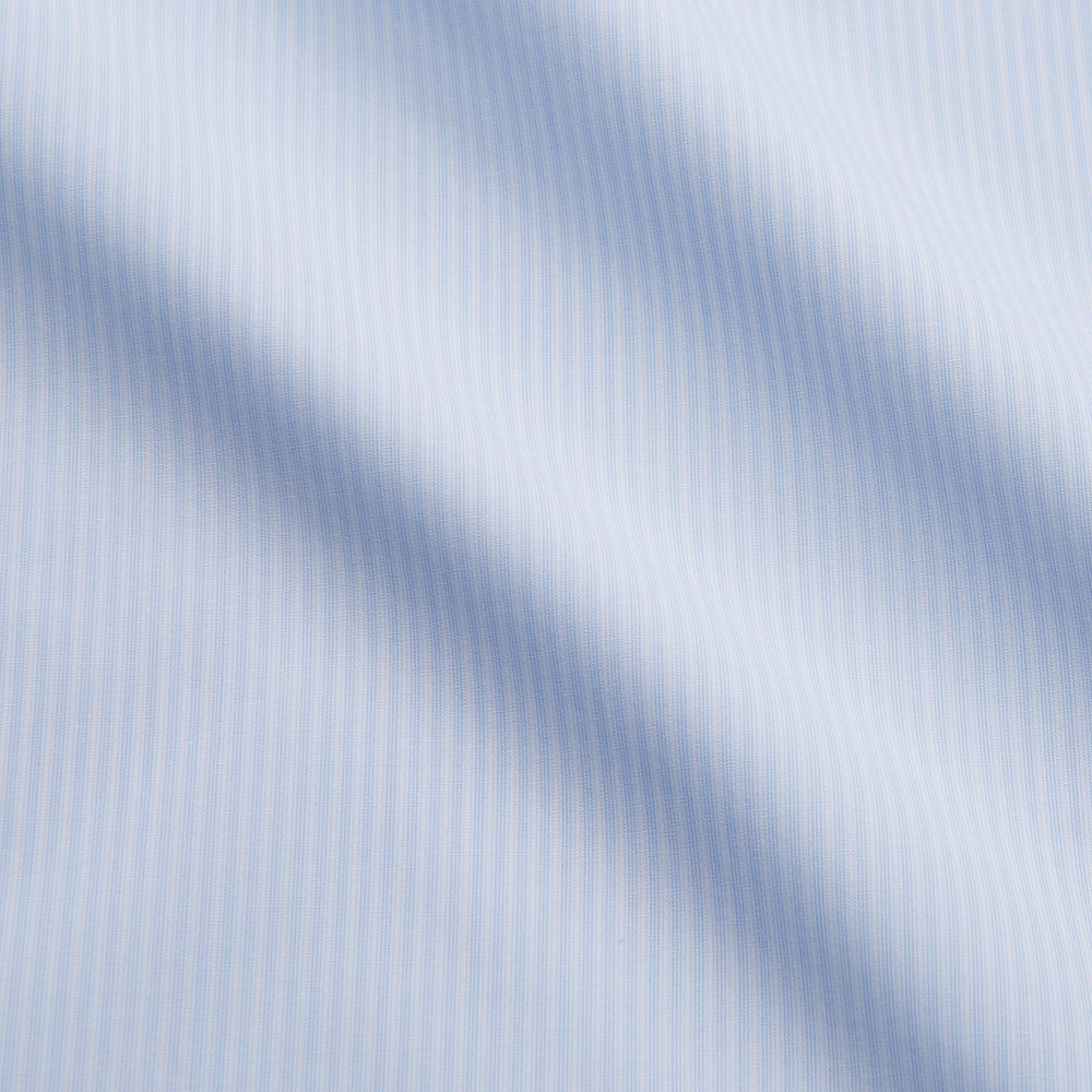 The Turnbull & Asser Pale Blue Stripe Cotton Weekend Fit Williams Shirt features short sleeves, a collar, a single chest pocket, and Italian cotton material, displayed on a plain white background.