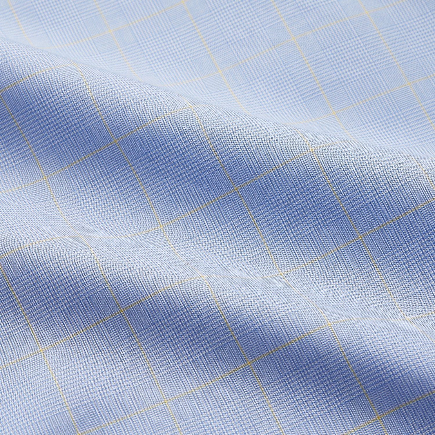 View 4 of product The Yellow and Blue Prince of Wales Check Belgravia Shirt by Turnbull & Asser features a classic collar, white buttons, long sleeves, and a checked pattern, displayed laid flat on a white background.