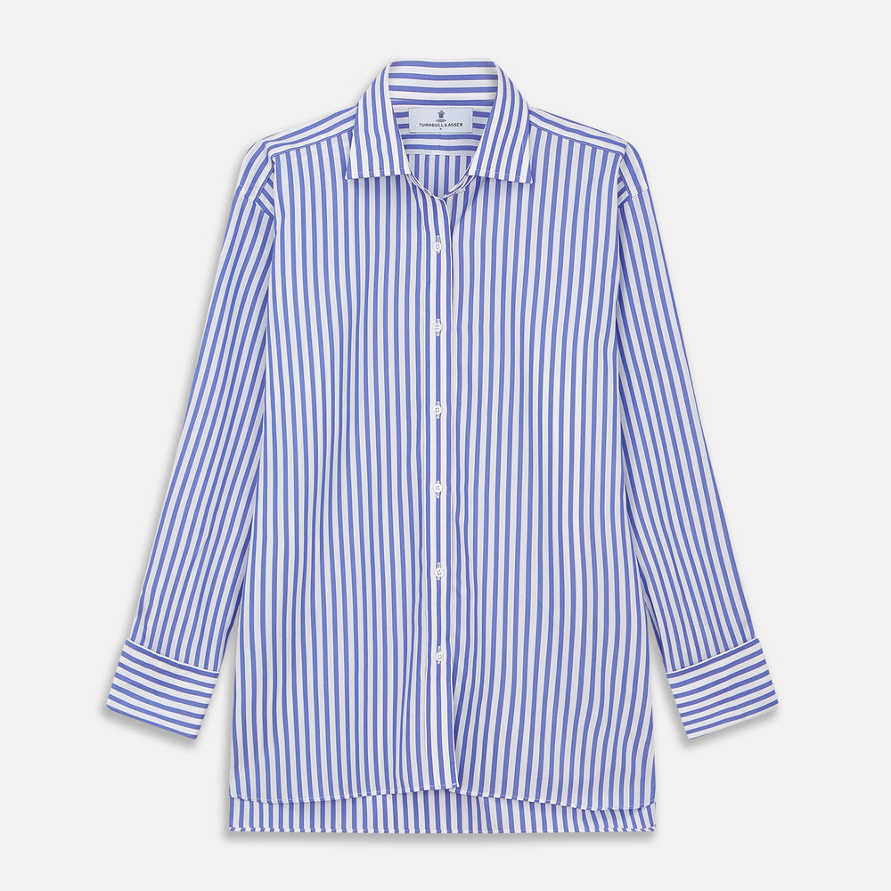 The Turnbull & Asser Pale Blue Candy Stripe Cotton Marlene Shirt is an oversized women's collared shirt with long sleeves, buttoned cuffs, and vertical blue and white stripes, shown laid flat on a white background.