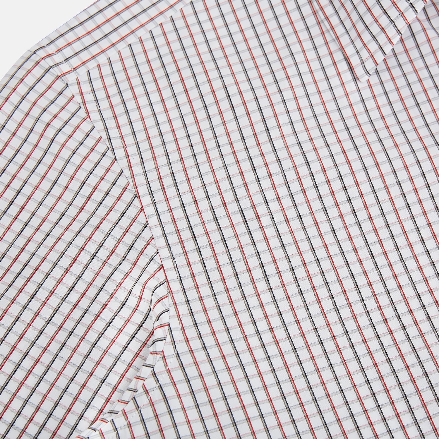 View 6 of product The Turnbull & Asser Red and Midnight Blue Tattersall Check Windsor Shirt features British craftsmanship, shown laid flat with sleeves extended and collar neatly folded.
