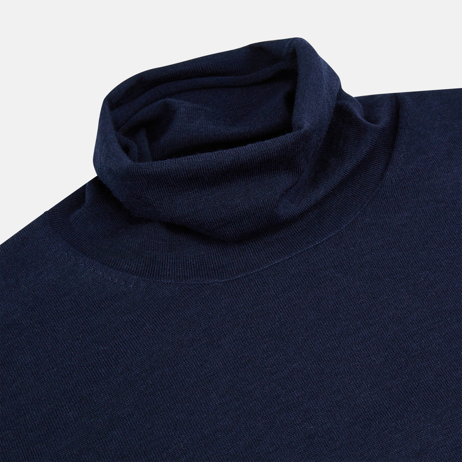 View 2 of product The Turnbull & Asser Navy Fine Merino High Neck Jumper, a plain long-sleeved piece crafted from premium merino wool, is shown on a white background.