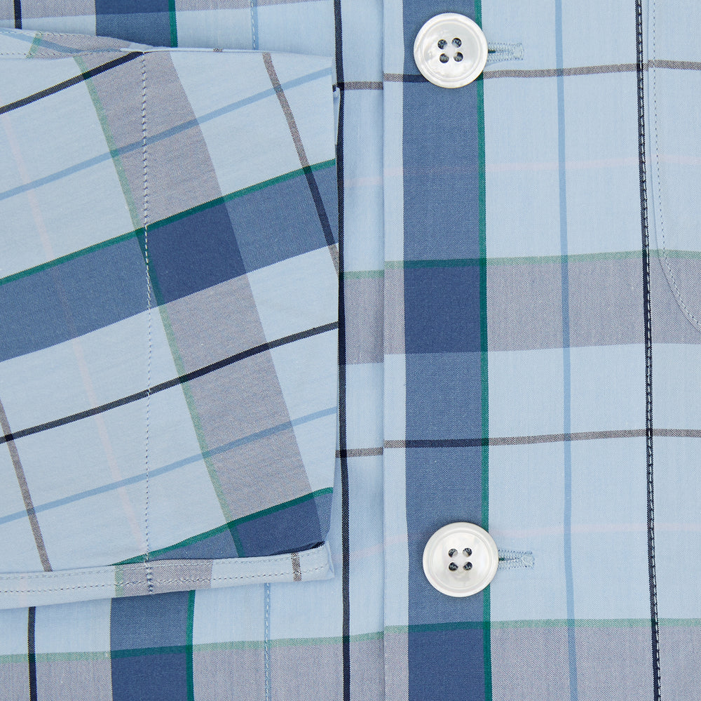 The Turnbull & Asser Blue Multi Check Pyjama Shirt features a blue and white check pattern, long sleeves, and a collar—an elegant loungewear option perfect for nightwear.