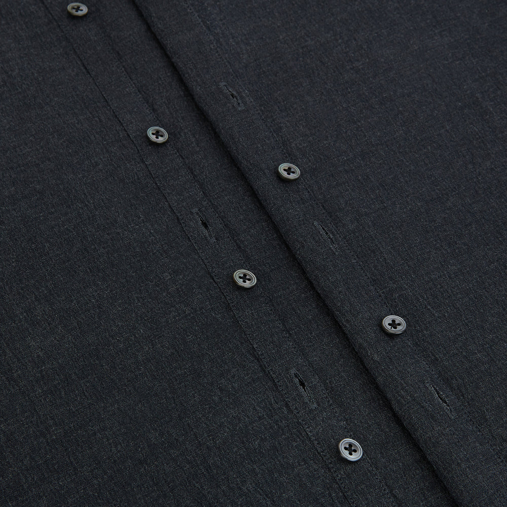 The Turnbull & Asser Midnight Blue Westminster Shirt features long sleeves, a button-up front, classic collar, and buttoned cuffs in a plain design—showcasing British craftsmanship—laid flat on a white background.