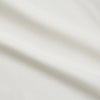 View 4 of product The Cream Silk Long Point Embroidered Eamon Shirt by Turnbull & Asser features long sleeves, a pointed collar, and delicate botanical embroidery. Its buttoned cuffs and tailored fit make it an elegant partywear choice.