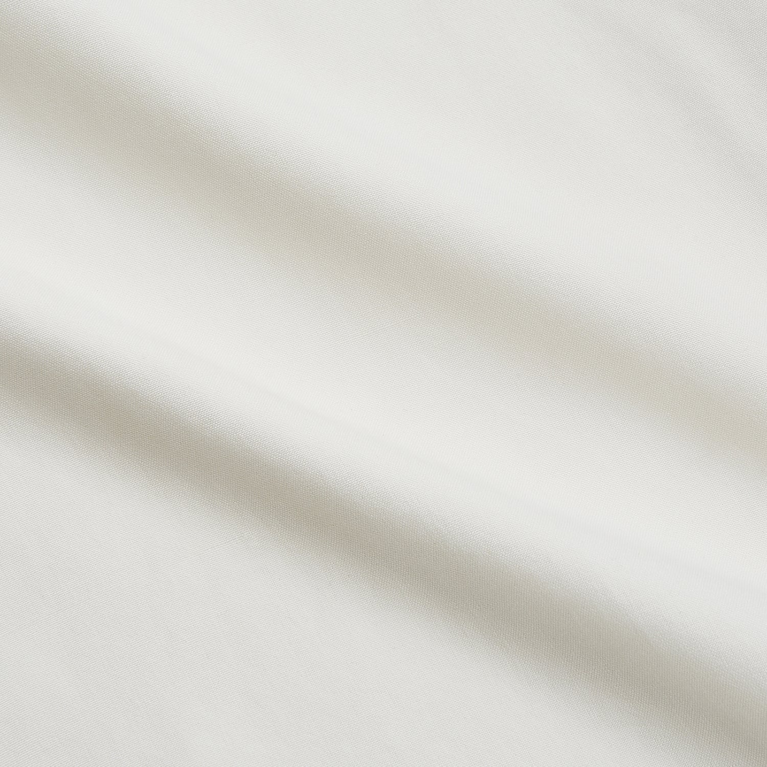 View 4 of product The Cream Silk Long Point Embroidered Eamon Shirt by Turnbull & Asser features long sleeves, a pointed collar, and delicate botanical embroidery. Its buttoned cuffs and tailored fit make it an elegant partywear choice.