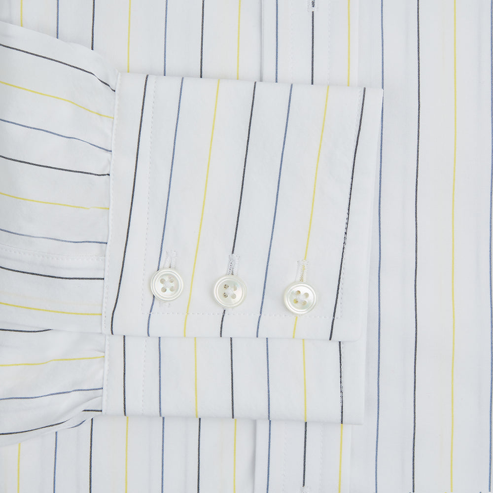The Navy and Yellow Wide Pinstripe Mayfair Shirt by Turnbull & Asser is a long-sleeve, button-up shirt with wide navy and yellow pinstripes, a collar, and buttoned cuffs, laid flat on a white surface.