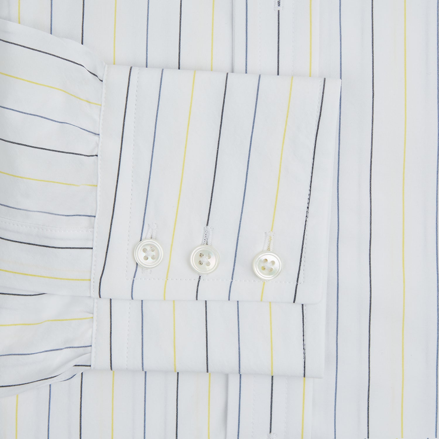 View 4 of product The Navy and Yellow Wide Pinstripe Mayfair Shirt by Turnbull & Asser is a long-sleeve, button-up shirt with wide navy and yellow pinstripes, a collar, and buttoned cuffs, laid flat on a white surface.
