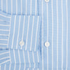 View 4 of product The Turnbull & Asser White and Blue Stripe Quarzo Nightshirt features long sleeves, a collar, button-up front, chest pocket, and mid-length hem—a classic men's striped sleepwear piece.