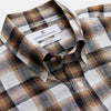 View 2 of product The Turnbull & Asser Brown Multi Check Linen Weekend Fit Hayne Shirt is a long-sleeve, button-up with a Dorset collar and buttoned cuffs, shown flat on a white background. It features a classic plaid pattern.