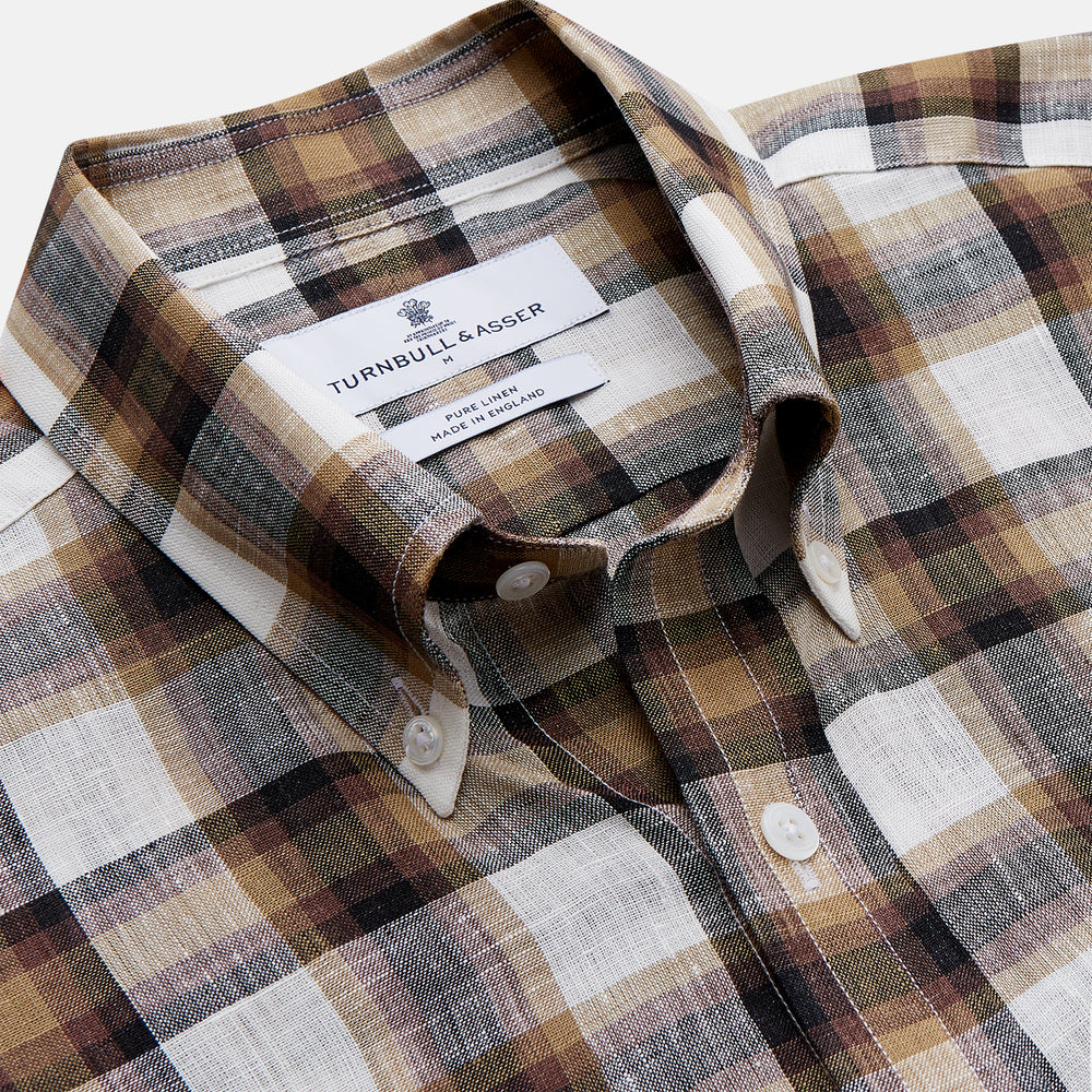 The Turnbull & Asser Brown Multi Check Linen Weekend Fit Hayne Shirt is a long-sleeve, button-up with a Dorset collar and buttoned cuffs, shown flat on a white background. It features a classic plaid pattern.