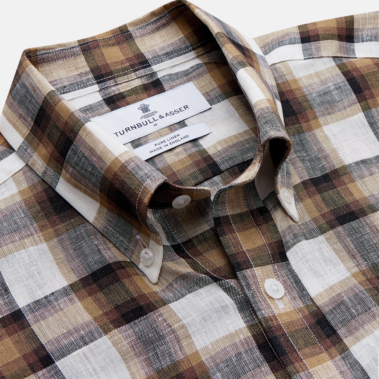View 2 of product The Turnbull & Asser Brown Multi Check Linen Weekend Fit Hayne Shirt is a long-sleeve, button-up with a Dorset collar and buttoned cuffs, shown flat on a white background. It features a classic plaid pattern.