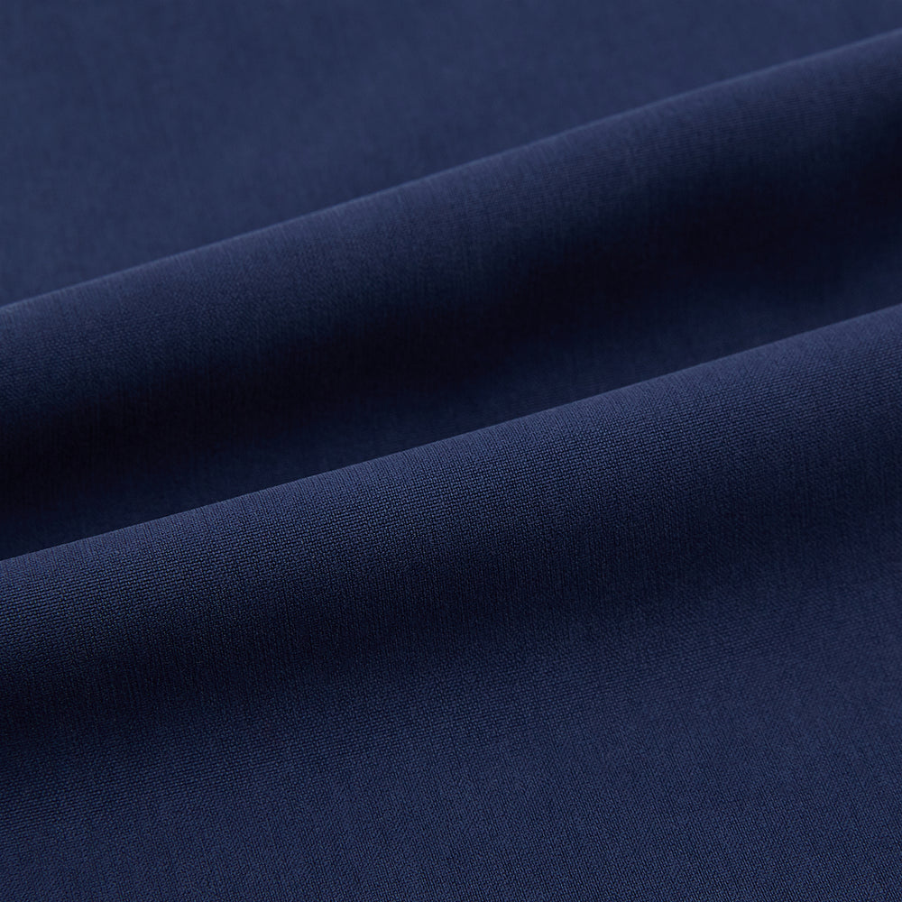 Turnbull & Asser Navy Silk Pyjama Set, laid flat on a white background, includes a long-sleeve button-up shirt with chest pocket and drawstring pants.