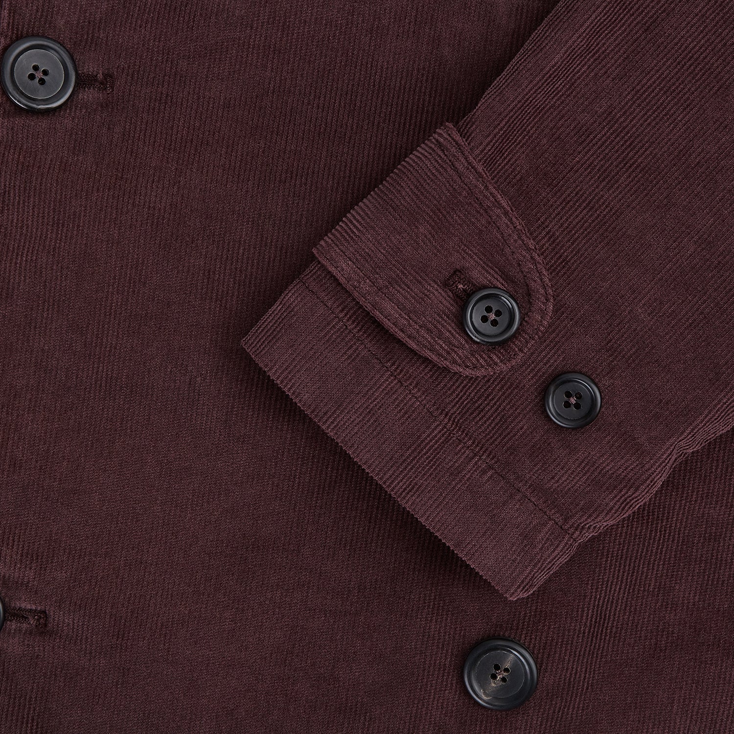 View 5 of product The Burgundy Kingston Corduroy Caban Jacket by Turnbull & Asser features black buttons, a notched collar, and front pockets. Crafted from premium cotton, it is shown on a plain white background.