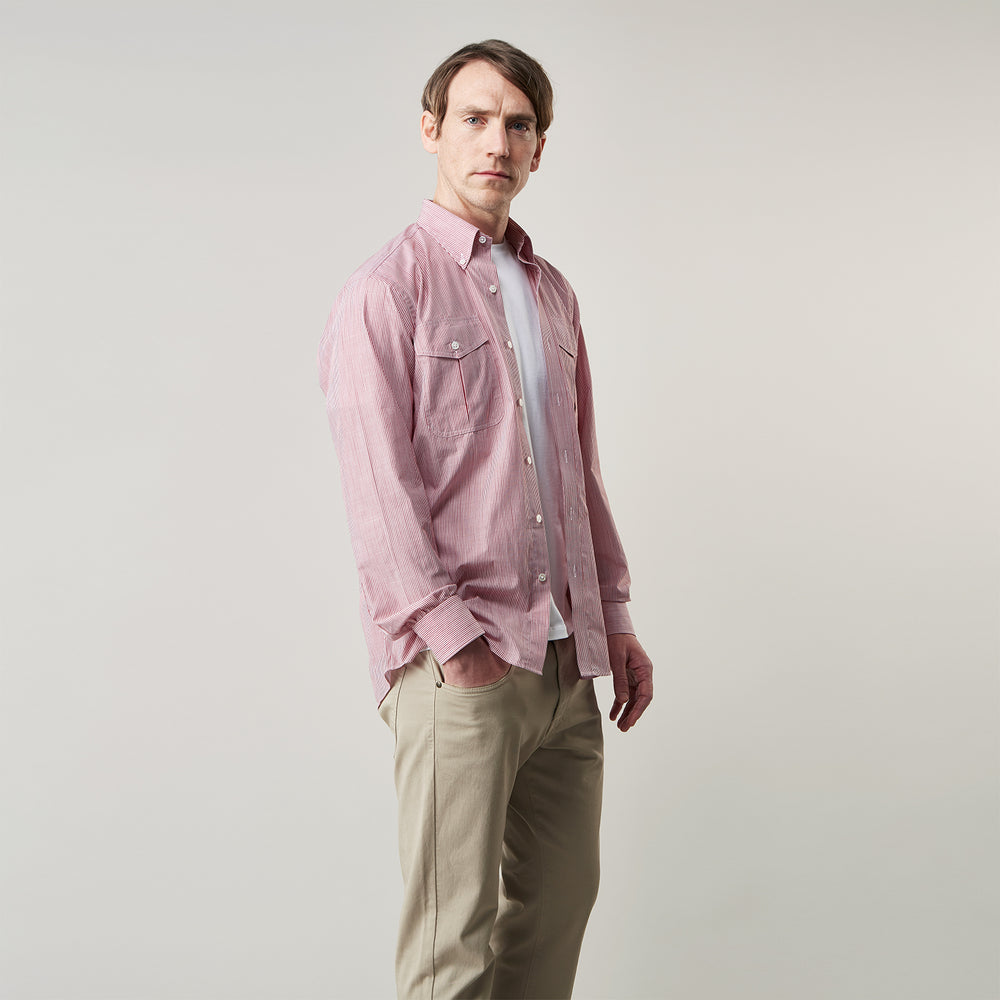 The Turnbull & Asser Dark Red Chambray Stripe Weekend Fit Shirt with a Dorset collar features striped cotton, two chest pockets with button flaps, and white front and cuff buttons—perfect for a relaxed yet stylish weekend look.