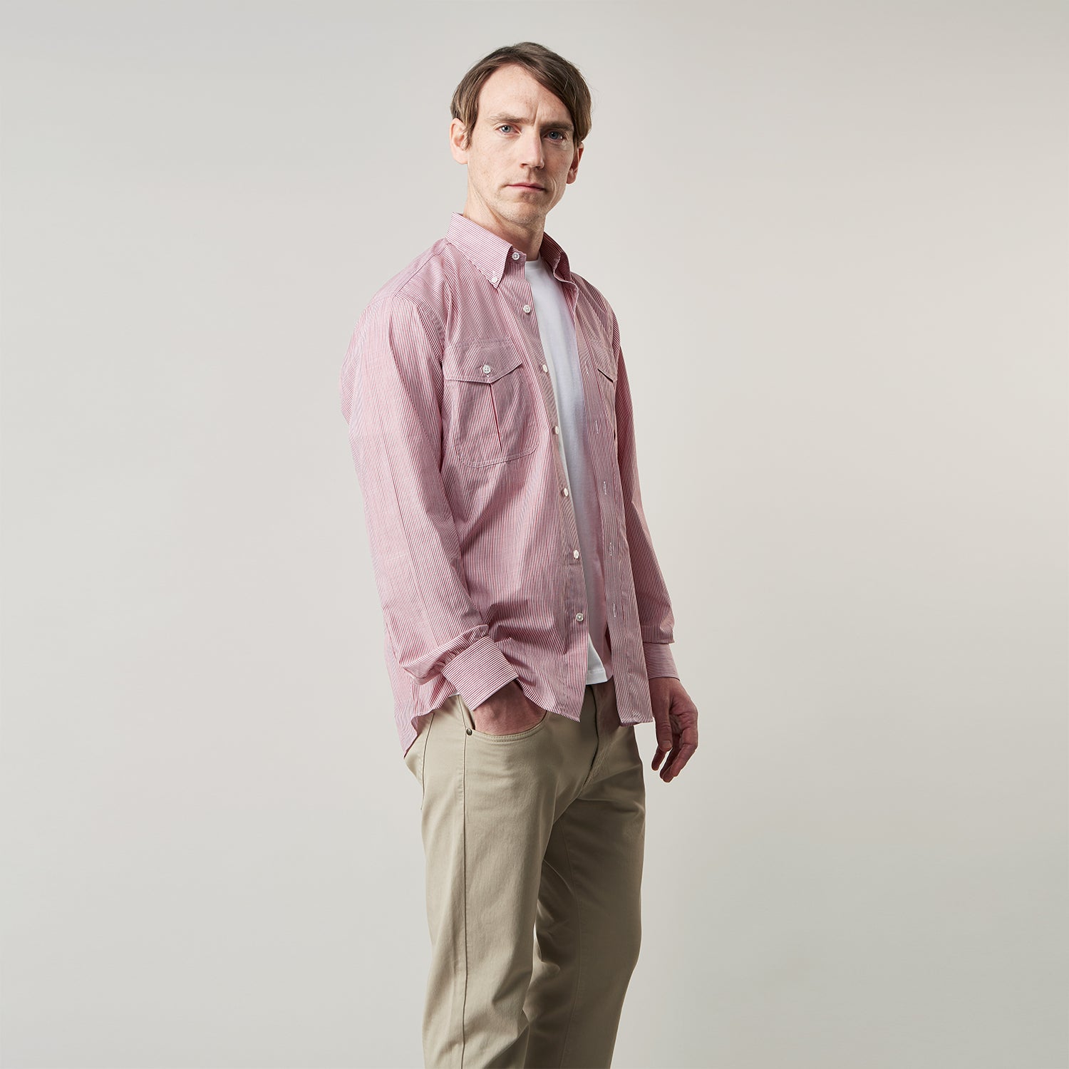 View 3 of product The Turnbull & Asser Dark Red Chambray Stripe Weekend Fit Shirt with a Dorset collar features striped cotton, two chest pockets with button flaps, and white front and cuff buttons—perfect for a relaxed yet stylish weekend look.
