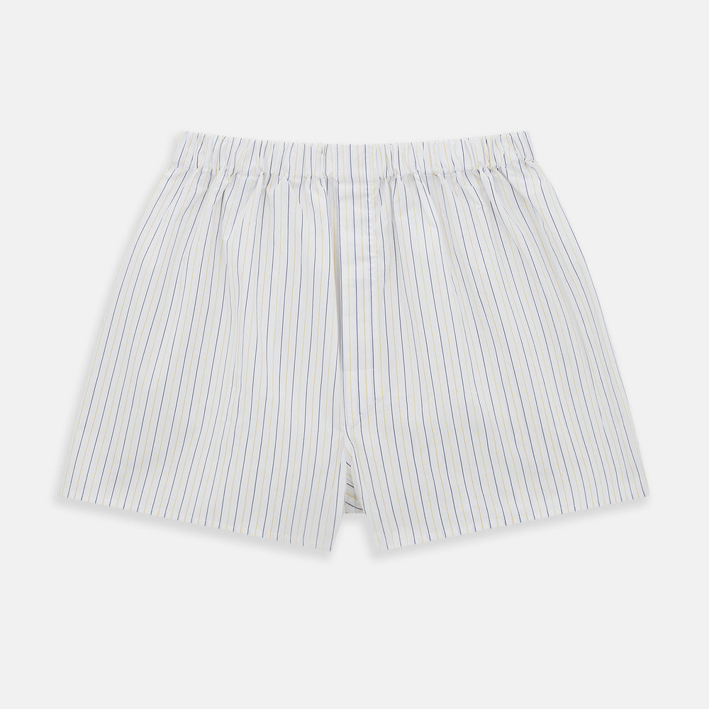 The Turnbull & Asser Yellow And Blue Stripe Godfrey Boxer Shorts feature vertical yellow and blue stripes, made from premium Italian cotton with an elastic waistband and relaxed fit, shown flat on a plain white background.