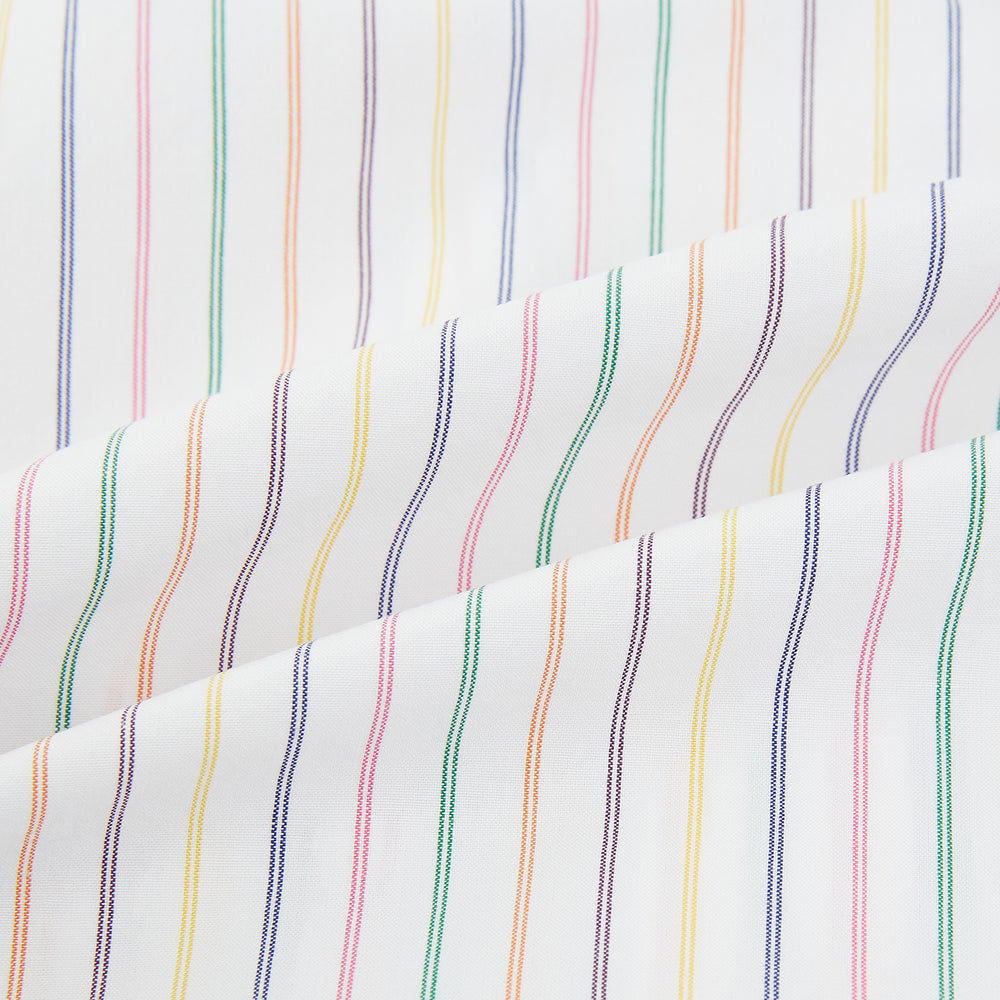 The Turnbull & Asser Rainbow Double Pinstripe Mayfair Shirt is a pure cotton, long-sleeved button-up with a collar and buttoned cuffs, featuring colourful blue, red, and yellow stripes on white, displayed on a plain white background.