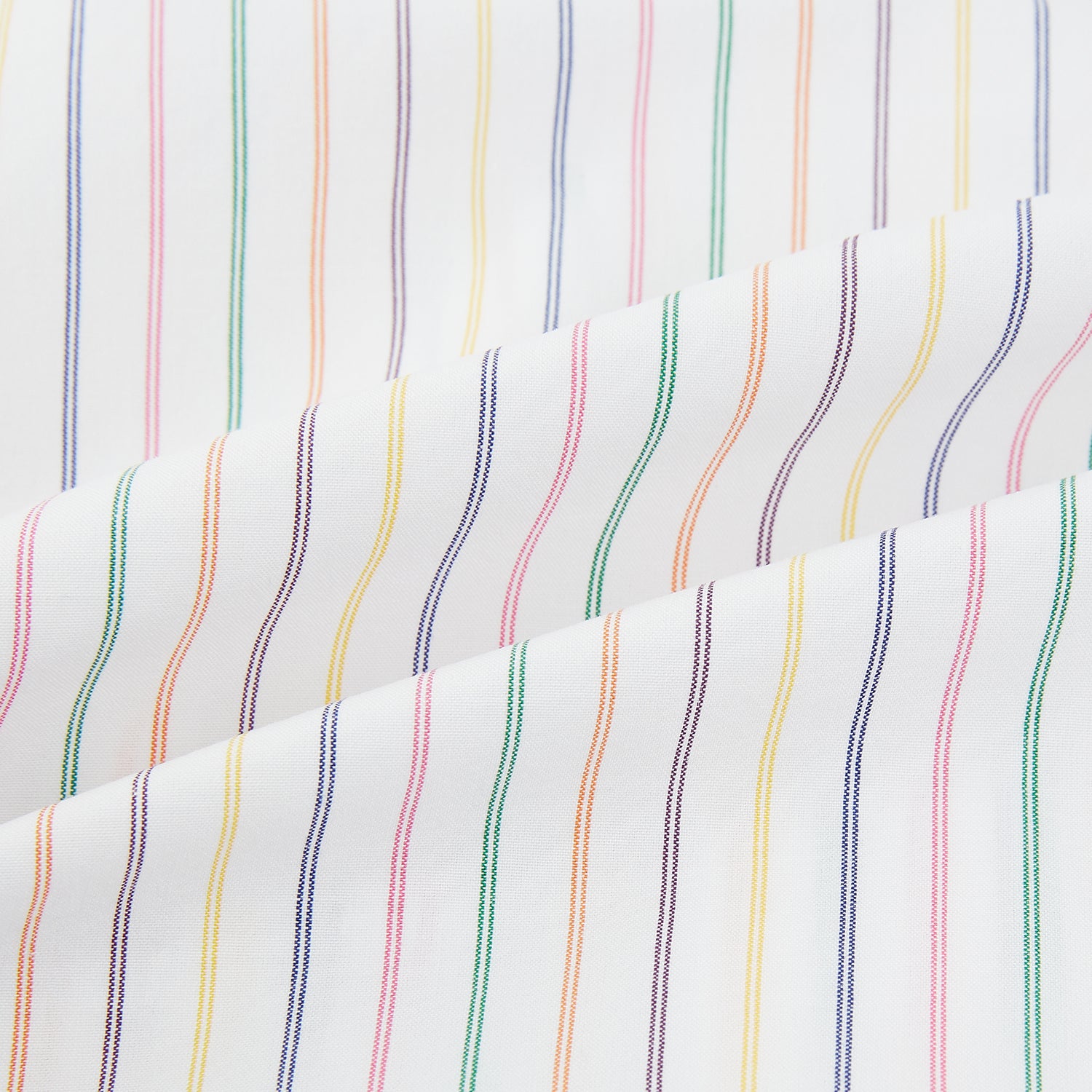 View 6 of product The Turnbull & Asser Rainbow Double Pinstripe Mayfair Shirt is a pure cotton, long-sleeved button-up with a collar and buttoned cuffs, featuring colourful blue, red, and yellow stripes on white, displayed on a plain white background.