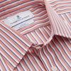 View 4 of product The Turnbull & Asser Orange and White Stripe Cotton Regular Fit Mayfair Shirt features vertical stripes, a classic collar, and buttoned cuffs—an essential men’s wardrobe piece, shown laid flat on a white background.