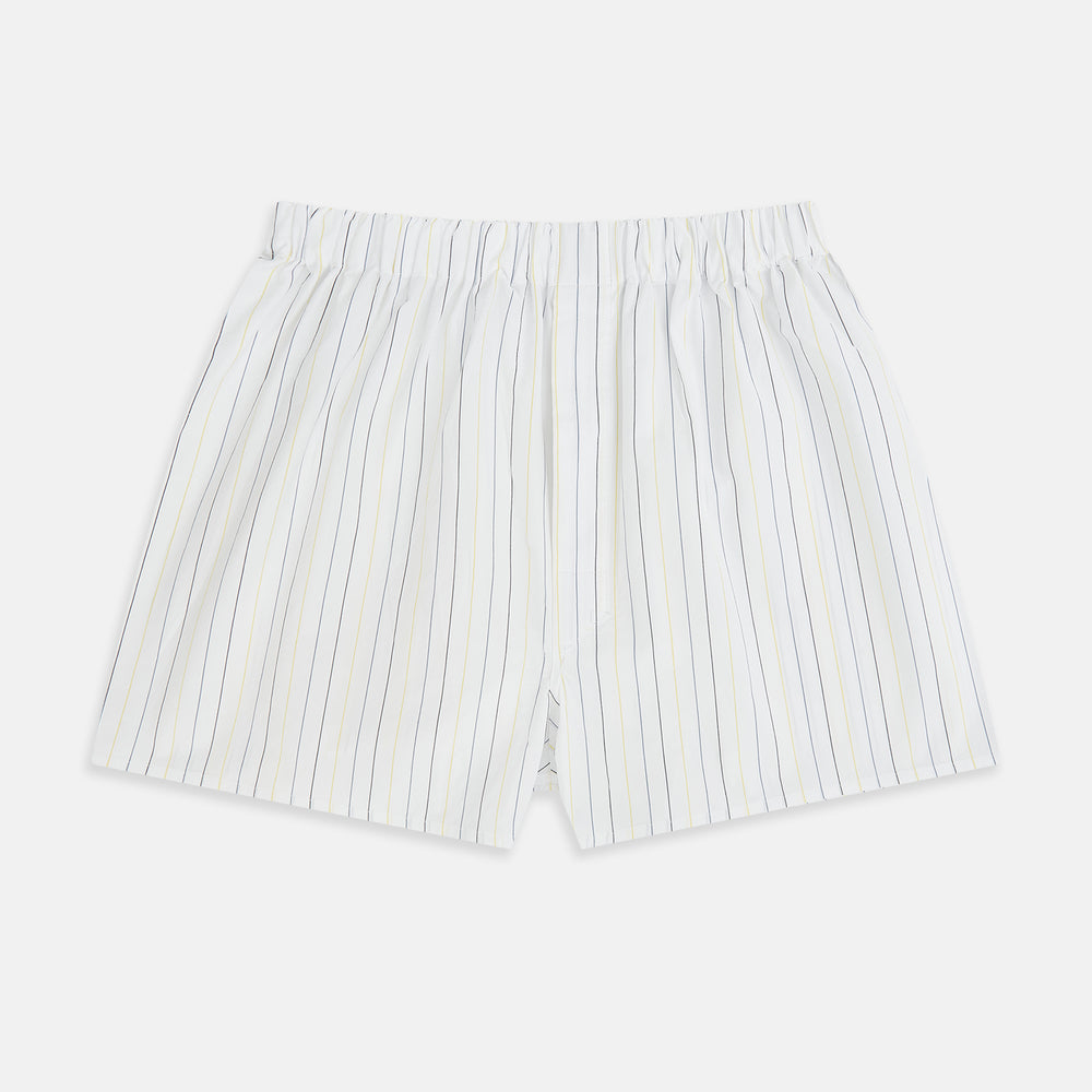 Turnbull & Asser's Yellow and Blue Double Stripe Godfrey Boxer Shorts are luxury men's underwear, made from premium Italian cotton with a loose fit, thin vertical blue and yellow stripes, and an elastic waistband on a white background.