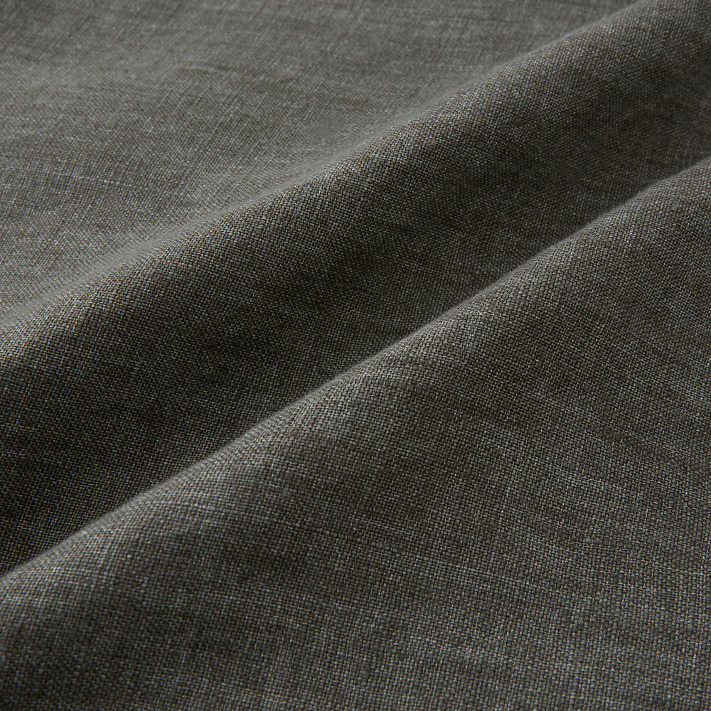 The Olive Linen Holland Shacket by Turnbull & Asser is a lightweight olive button-up jacket in Irish linen with a collar, two front pockets, one chest pocket, and slanted hem pockets—ideal outerwear shown on a plain white background.