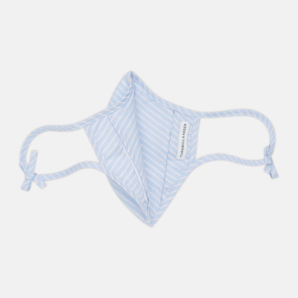 Turnbull & Asser's Exclusive Light Blue, White & Pink Stripe Commuter Mask features ear loops tied in bows and includes 3 VIROFORMULA™ filters for enhanced protection and comfort.