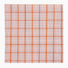 View 4 of product The Turnbull & Asser Hand Rolled Orange Graph Overlay Check Handkerchief features bold orange and white checks with blue and orange grid lines—a refined, classic accessory for any gentleman.