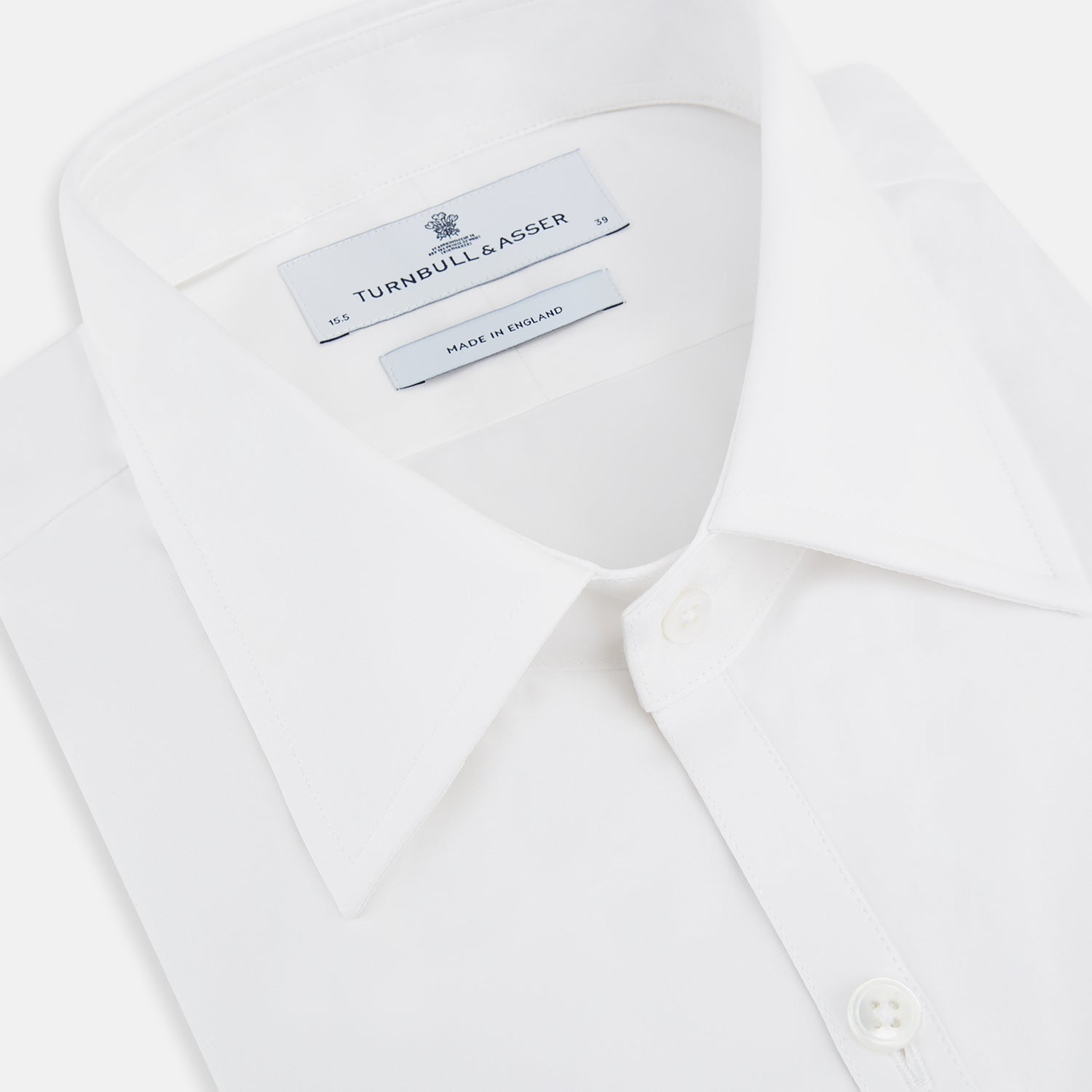 View 2 of product The Turnbull & Asser White Westminster Shirt is a long-sleeve, button-up dress shirt with a classic cut and Westminster collar, shown on a white background.