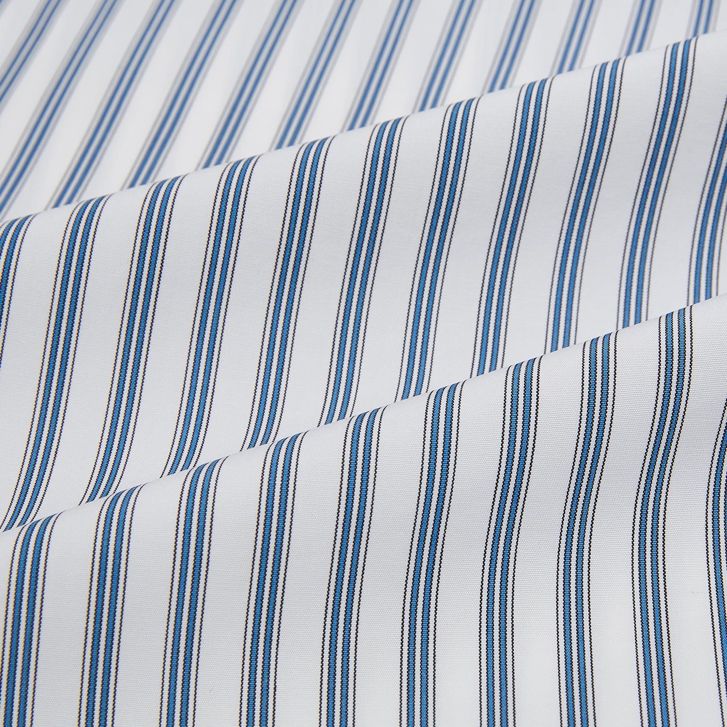 View 6 of product The Turnbull & Asser Blue Multi Wide Track Stripe Mayfair Shirt is a long-sleeve, button-up shirt with a classic collar and vertical blue and white stripes, shown on a white background.