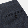 View 2 of product The Turnbull & Asser Navy Check Wool and Cashmere Blend Wilson Trousers feature a subtle plaid, belt loops, front pleats, and a straight-leg fit, displayed against a light background.