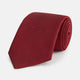 The HORIZONTAL TWILL BURGUNDY TIE by Turnbull & Asser features a subtle textured pattern in solid burgundy, rolled neatly and displayed against a white background—a versatile addition to any gentleman’s wardrobe.