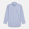 View 1 of product The Turnbull & Asser Mid-Blue Chambray Weekend Fit Shirt features a Dorset collar, white buttons, and 1-button cuffs. It is laid flat on a white background.