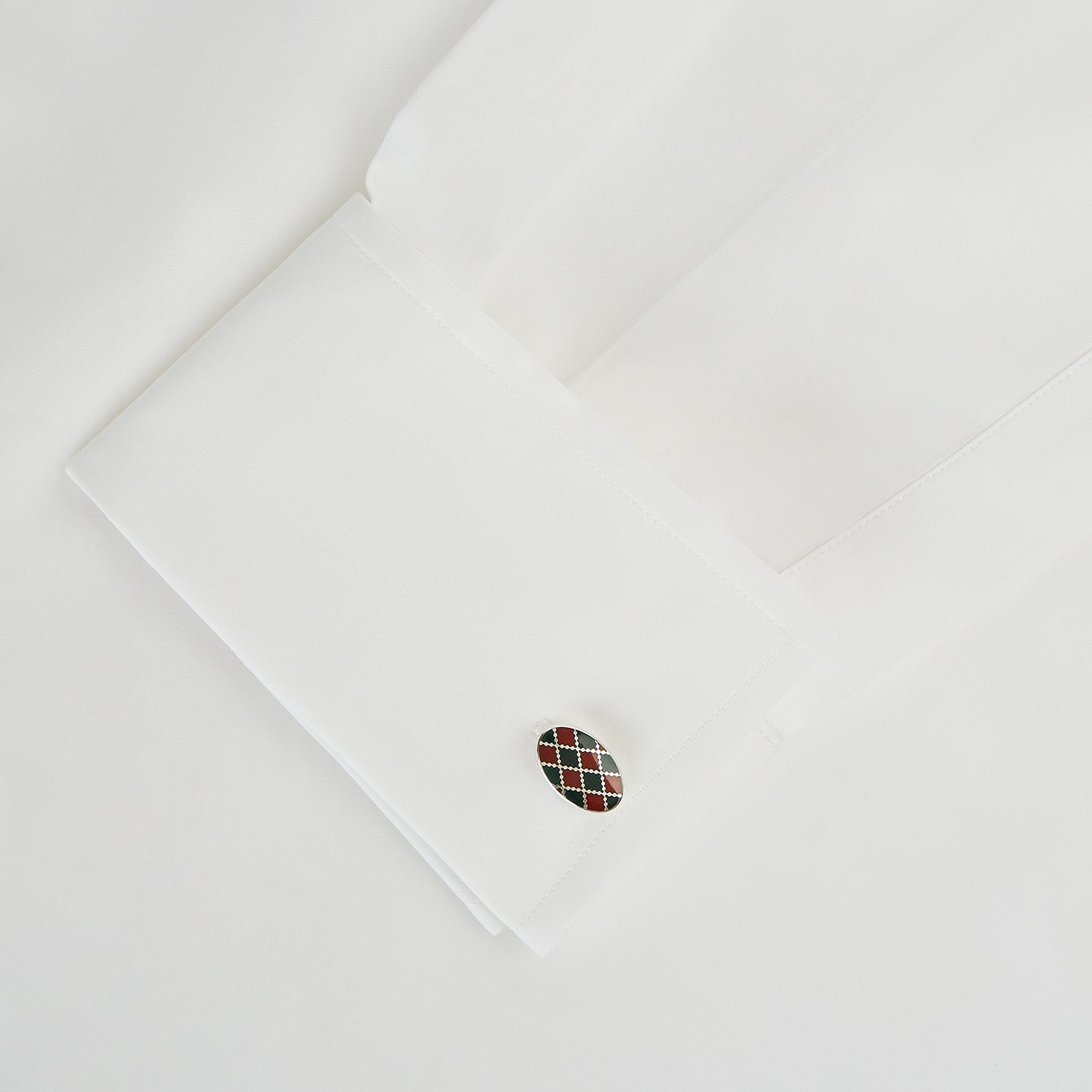 View 3 of product Turnbull & Asser’s Forest Green and Burgundy Checkered Oval Enamel Chain Cufflinks showcase masculine elegance with their sophisticated pattern and refined silver finish.