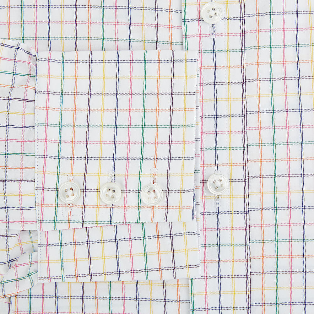 The Rainbow Double Grid Check Mayfair Shirt by Turnbull & Asser features a white base with thin blue, red, and green checks and a T&A collar. It’s displayed neatly laid flat on a white background.