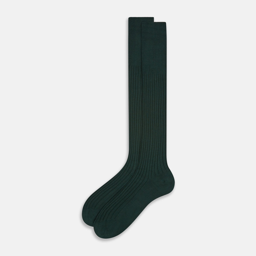 The Turnbull & Asser Olive Long Socks, featuring a ribbed texture, are shown over the calf on a plain white background—a refined addition to any men’s dress sock collection.