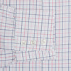 View 4 of product The Turnbull & Asser Pink Overlay Grid Check Mayfair Shirt is a long-sleeved, button-up with a collar and buttoned cuffs, featuring a white base and thin pink grid lines. Laid flat against a white surface.