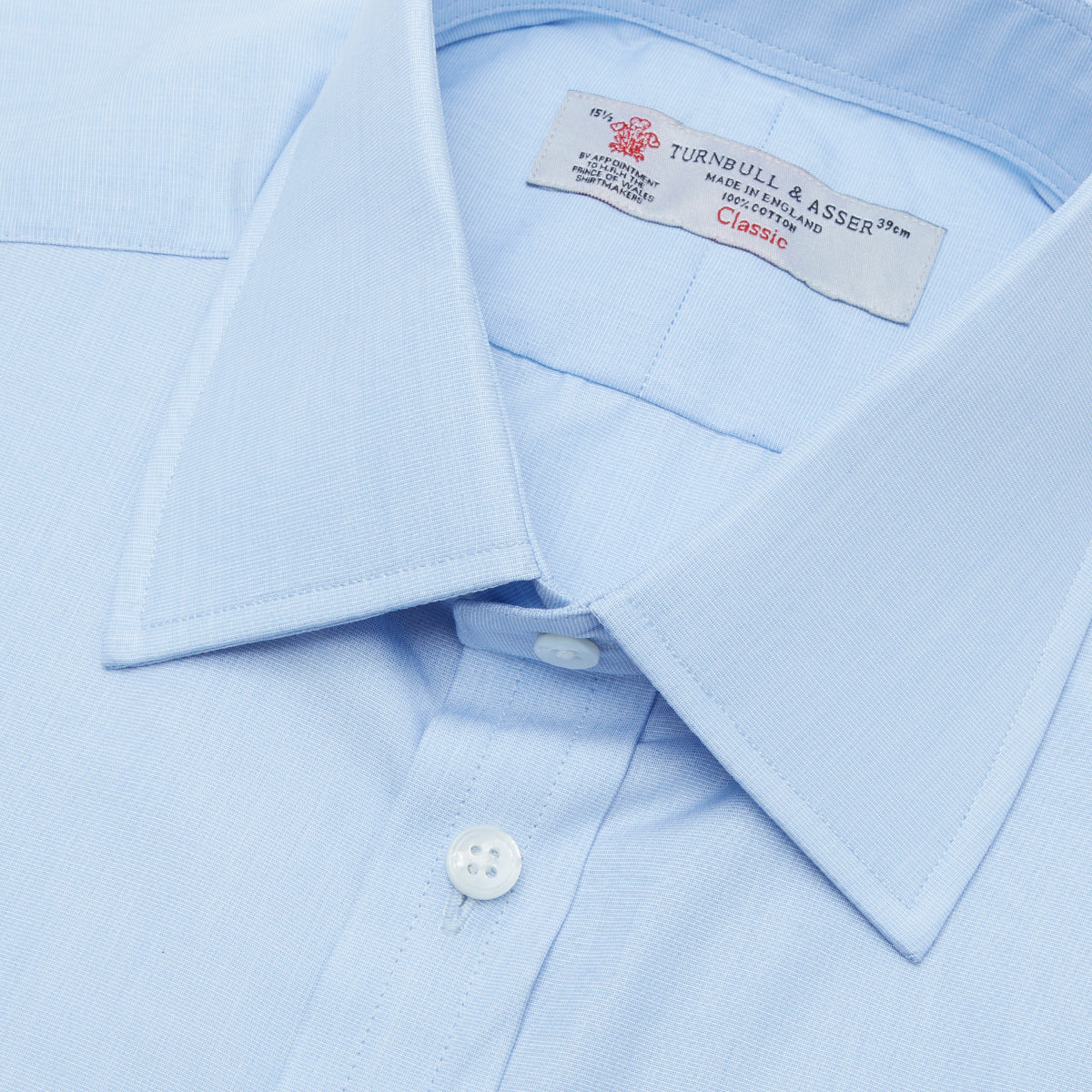View 5 of product The Turnbull & Asser Light Blue End-on-End Shirt features a T&A collar and 3-button cuffs, neatly displayed against a plain white background—ideal for pairing with a navy suit.
