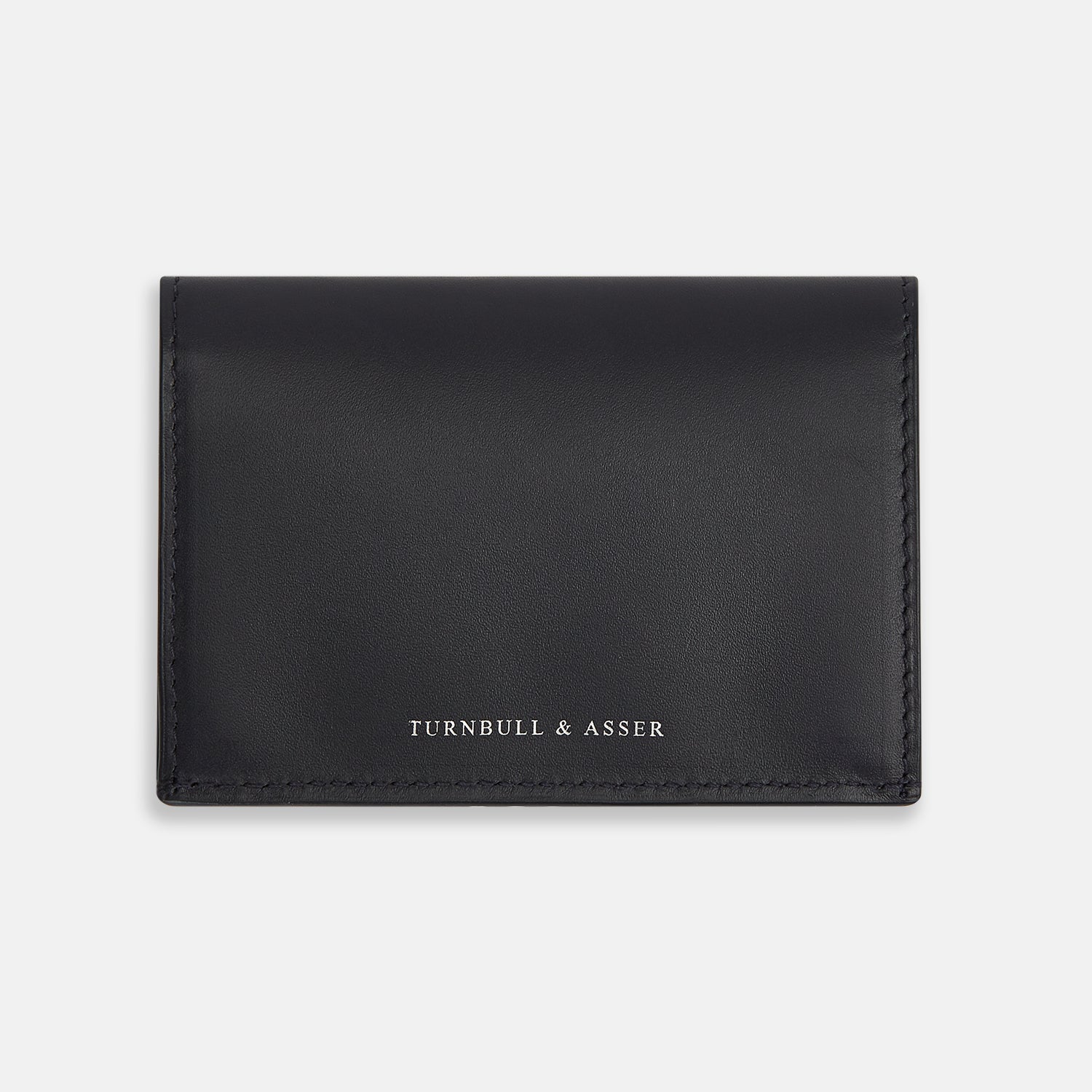View 1 of product A navy full-grain leather bi-fold card holder with neat stitching and "Turnbull & Asser" embossed in white near the bottom center.