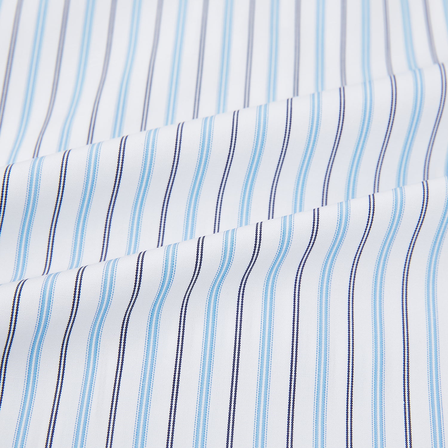 View 6 of product The Turnbull & Asser Blue Multi Halo Stripe Mayfair Shirt features long sleeves, a T&A collar with pointed tips, and buttoned cuffs, shown on a plain white background.