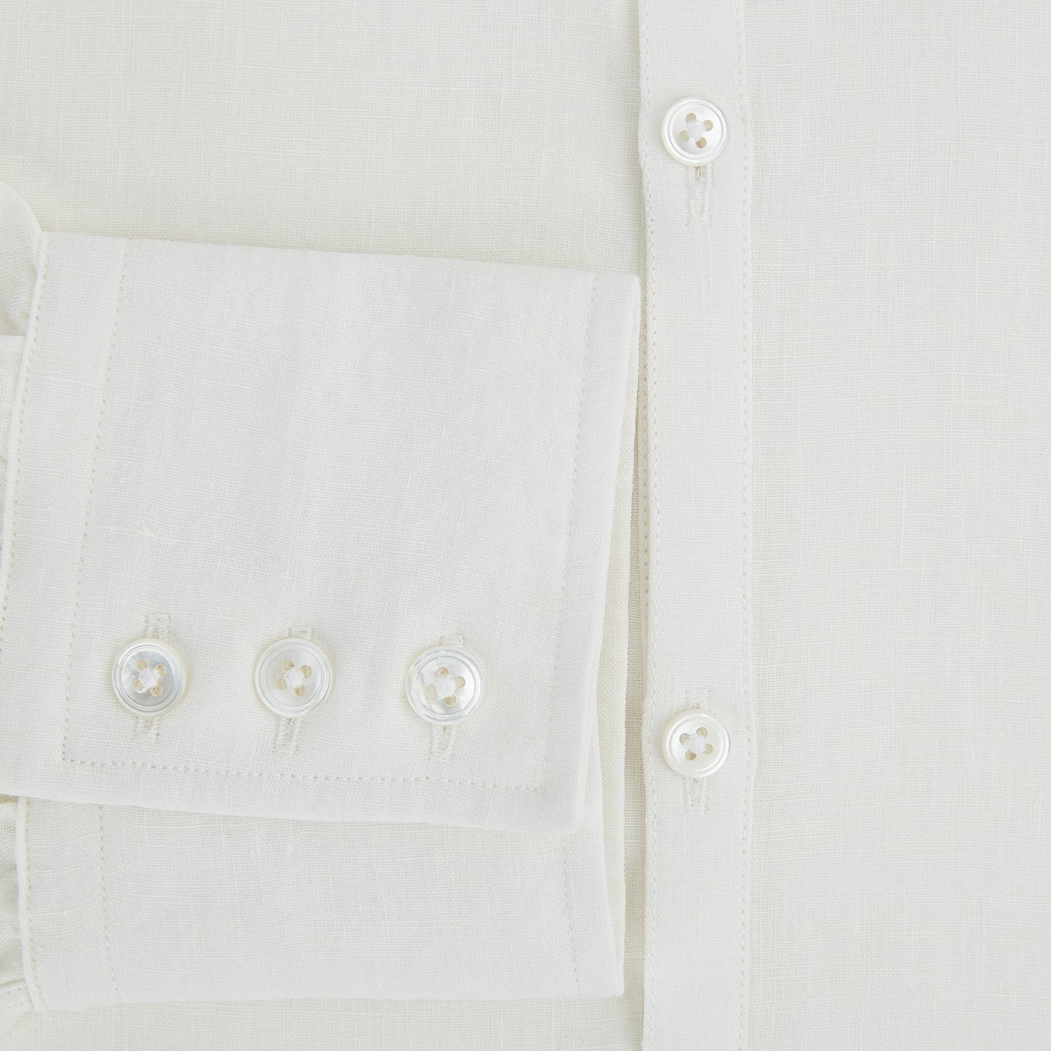 View 4 of product The Vanilla Linen Westminster Shirt by Turnbull & Asser is a long-sleeve, white button-up with a Turnbull collar, buttoned cuffs, and straight hem, highlighting British craftsmanship against a plain white background.