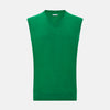 View 1 of product The Turnbull & Asser Grass Green Cashmere V-Neck Vest is shown against a plain white background, offering a refined choice for a distinguished ensemble.