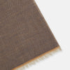 View 2 of product The Turnbull & Asser Camel and Grey Melange Cashmere Scarf features ultra-soft cashmere in a subtle plaid, looped with short fringe edges, shown against a plain white background.