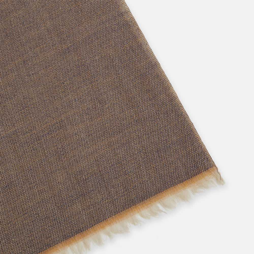 The Turnbull & Asser Camel and Grey Melange Cashmere Scarf features ultra-soft cashmere in a subtle plaid, looped with short fringe edges, shown against a plain white background.