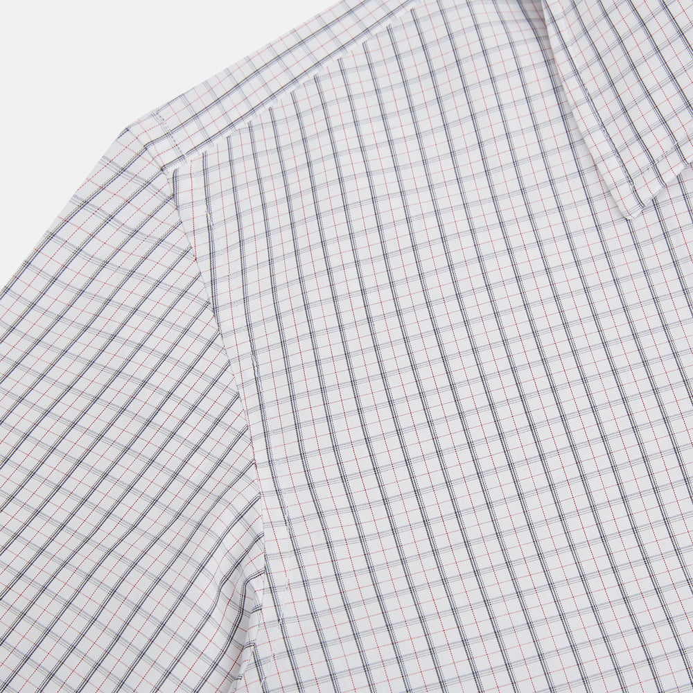 The Blue and Red Graph Check Westminster Shirt by Turnbull & Asser features a classic collar, long sleeves, and British craftsmanship, with a blue and red checkered pattern on white, displayed flat on a white surface.