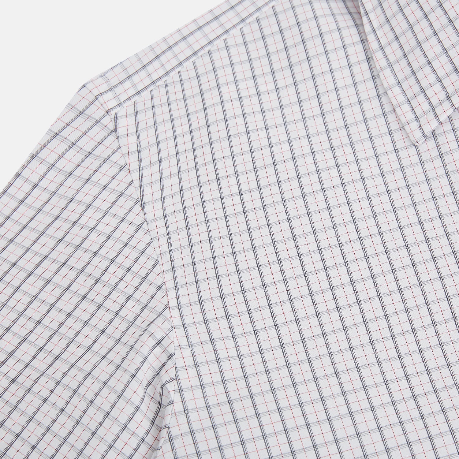 View 6 of product The Blue and Red Graph Check Westminster Shirt by Turnbull & Asser features a classic collar, long sleeves, and British craftsmanship, with a blue and red checkered pattern on white, displayed flat on a white surface.