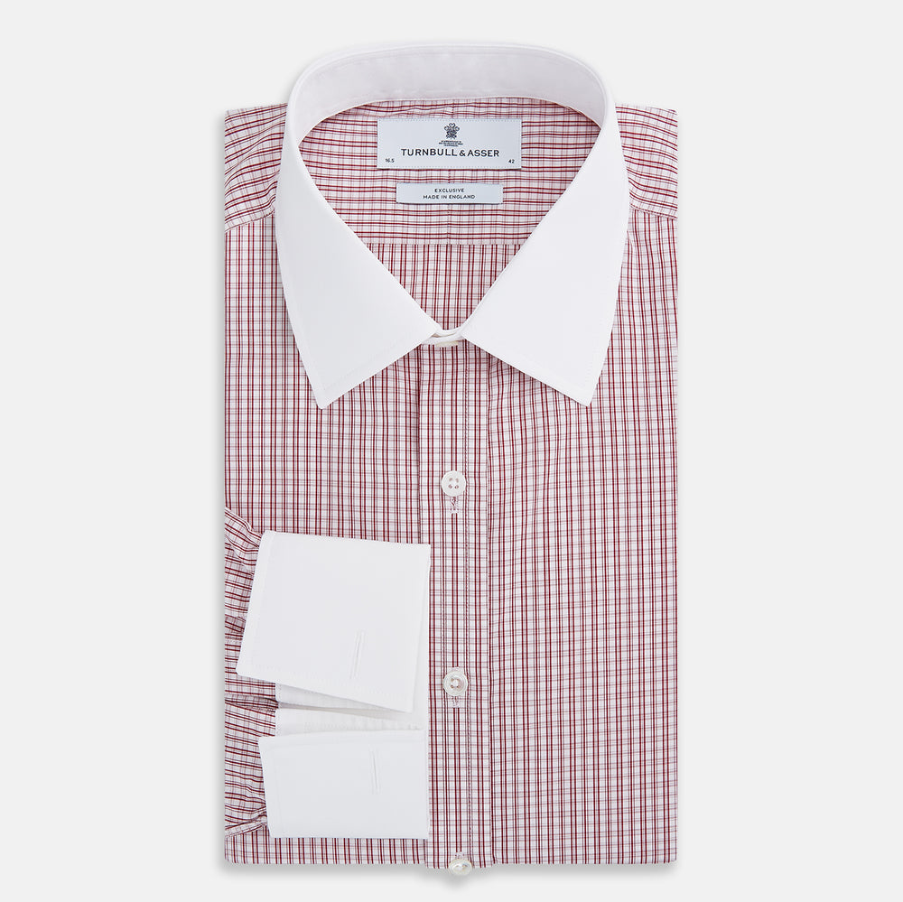 The Turnbull & Asser Red Micro Check Shirt features a crisp white contrast T&A collar and cuffs, crafted in Italian cotton. Timeless style is showcased against a plain white background, inspired by classic Turnbull & Asser designs.